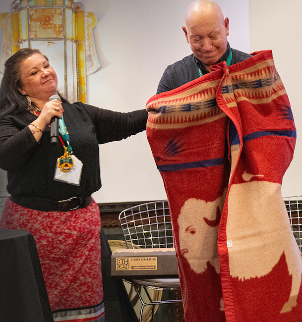 Jeff Tripician from Niman Ranch, and Dawn Sherman of Native American Natural Foods during a special blanket ceremony at the Edible Magazines Conference
