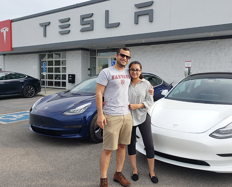 Nida and Shahaan and their Tesla EV-Clean Energy CU