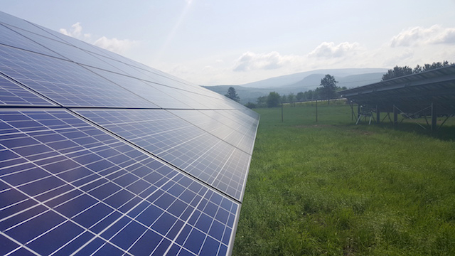 A view of the Green Mountains from a community solar project in Vermont