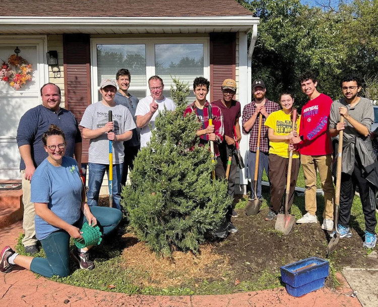 Missy Stults, Bryant residents and Community Action Network members plant trees - Grist